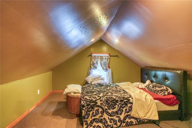 carpeted bedroom with vaulted ceiling