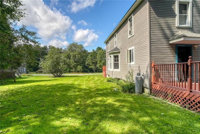 view of yard with a wooden deck