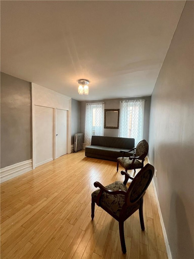 sitting room featuring light hardwood / wood-style floors and radiator