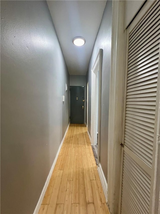 hall with light hardwood / wood-style flooring