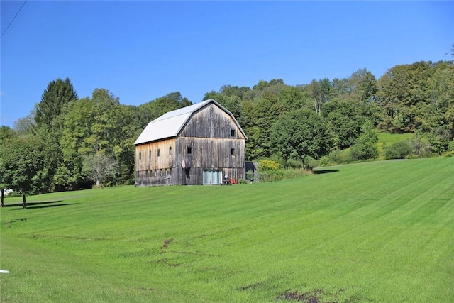 view of outdoor structure with a lawn