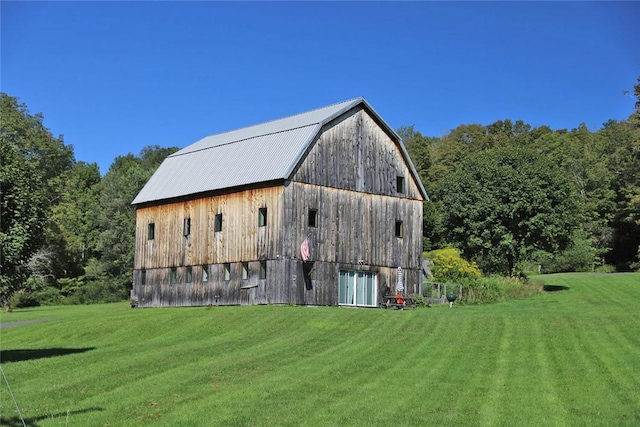 view of outdoor structure with a lawn