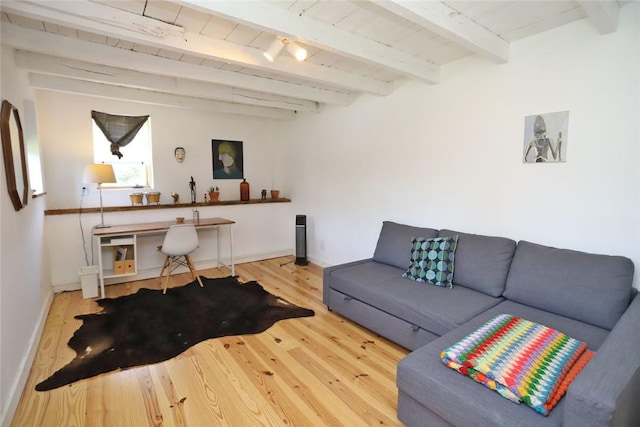 living room featuring hardwood / wood-style floors and beamed ceiling