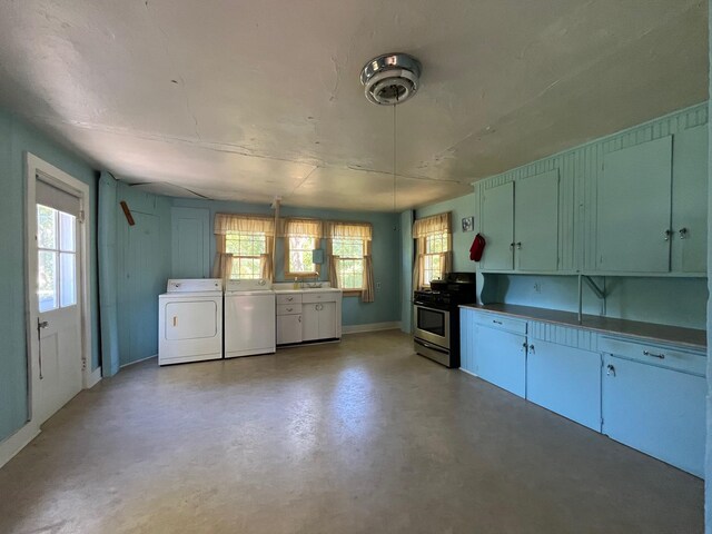 79 Powder House Rd, Amenia, NY 12501 - kitchen with washer / dryer, stainless steel range with gas cooktop, finished concrete flooring, and baseboards