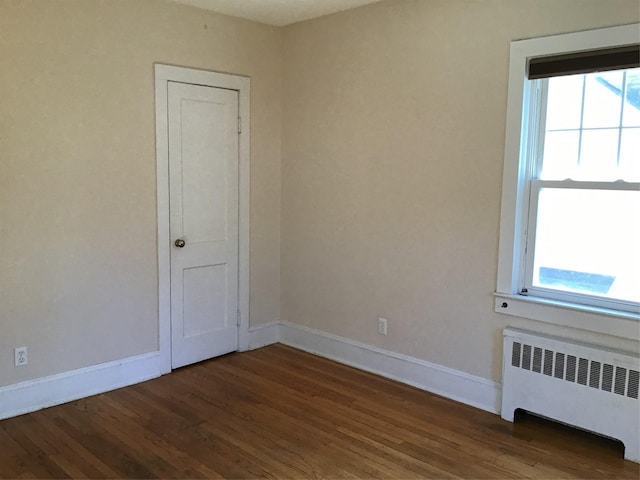 empty room featuring ornamental molding and wooden ceiling