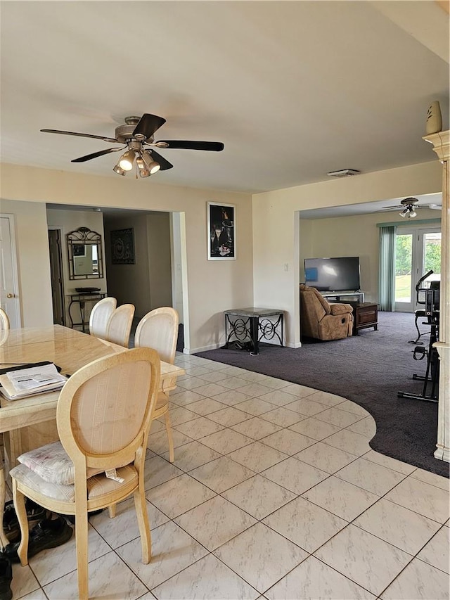 interior space with tile walls and ceiling fan