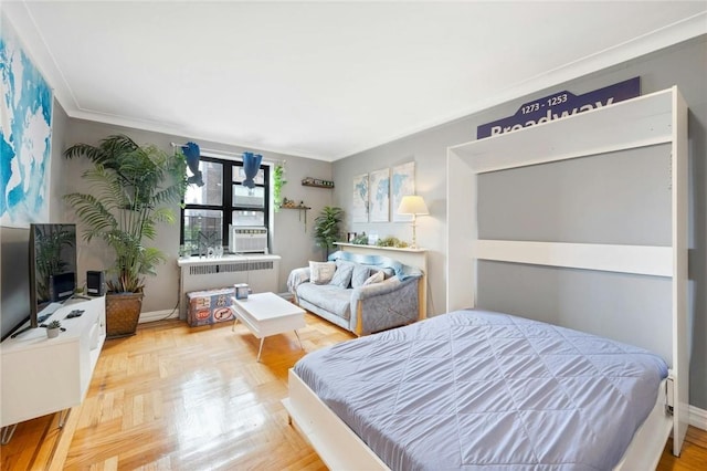 bedroom featuring cooling unit, radiator heating unit, crown molding, and parquet floors