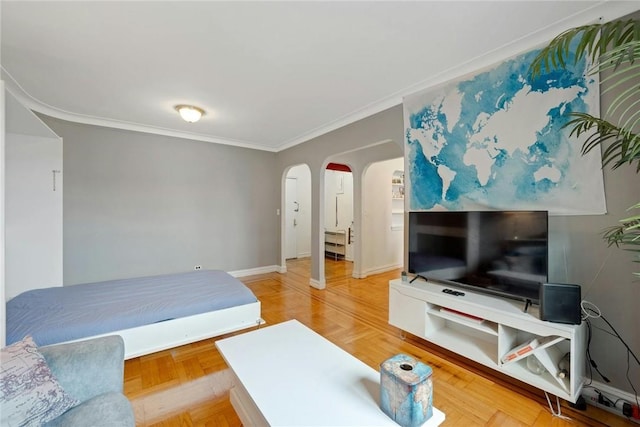 living room featuring parquet flooring and ornamental molding