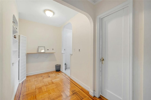 clothes washing area featuring light parquet floors