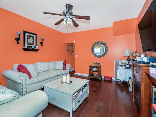 living room with dark hardwood / wood-style floors and ceiling fan