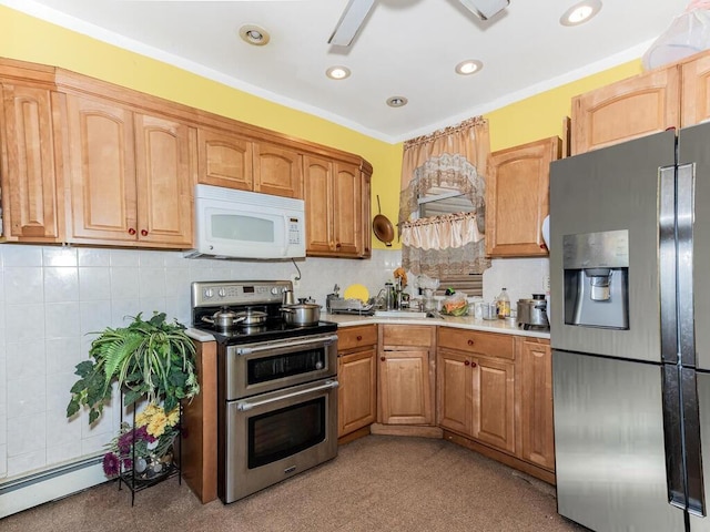 kitchen featuring tasteful backsplash, crown molding, stainless steel appliances, and a baseboard heating unit