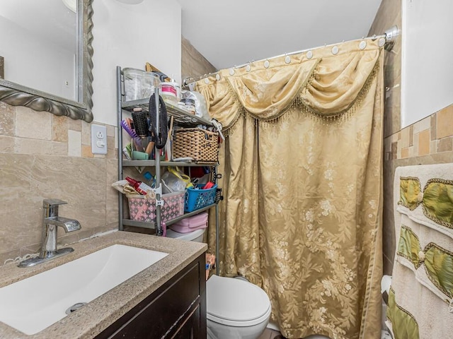 bathroom featuring decorative backsplash, vanity, and toilet