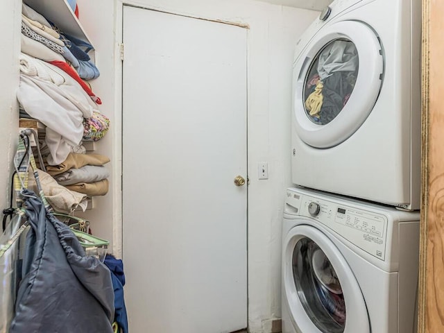 laundry area with stacked washing maching and dryer