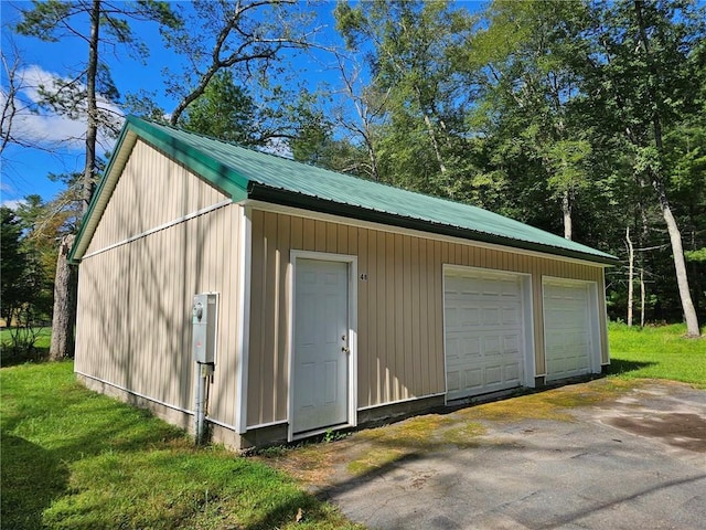 view of outbuilding featuring a garage