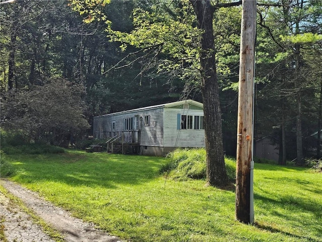 view of outdoor structure featuring a yard