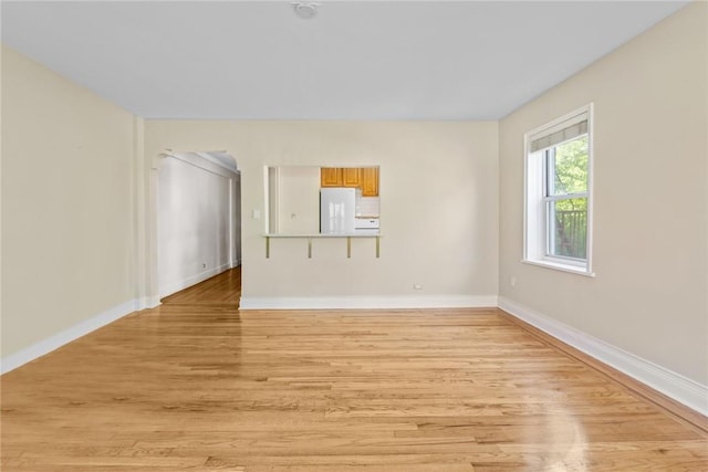 spare room featuring light hardwood / wood-style flooring