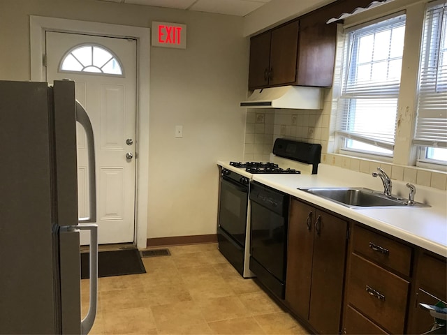 kitchen featuring dark brown cabinetry