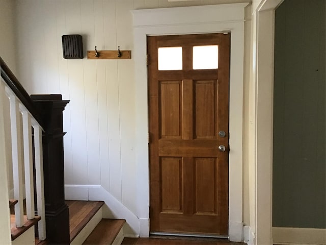 interior space featuring wood walls