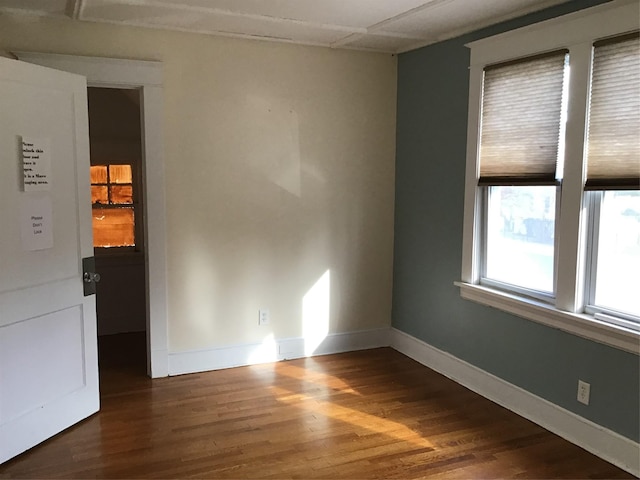 empty room featuring wood ceiling