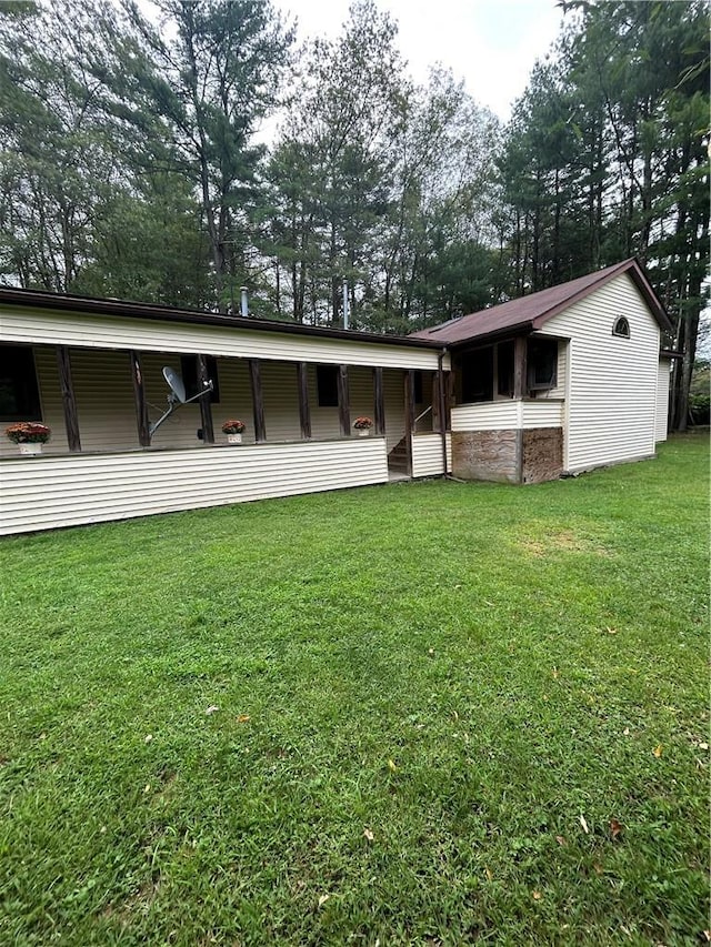 110 Foss Ln, Huguenot, NY 12746 - back of house featuring a yard and view of wooded area