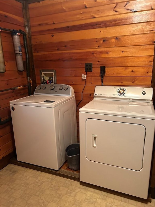 110 Foss Ln, Huguenot, NY 12746 - laundry area with washer and dryer, wooden walls, and light flooring