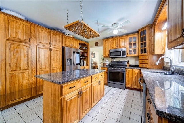 29 Hillview Dr, Poughkeepsie, NY 12603 - kitchen with appliances with stainless steel finishes, light tile patterned flooring, and brown cabinetry