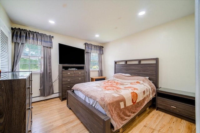 29 Hillview Dr, Poughkeepsie, NY 12603 - bedroom featuring baseboard heating, light wood-style flooring, and recessed lighting