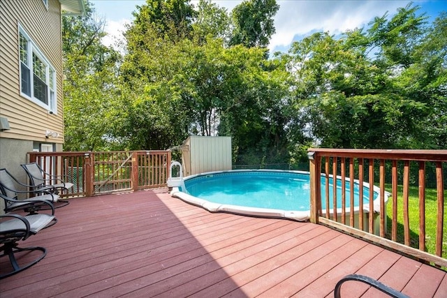 view of swimming pool featuring a deck