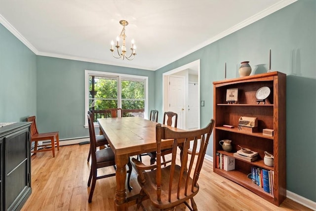 dining room featuring a baseboard heating unit, light hardwood / wood-style floors, crown molding, and a notable chandelier