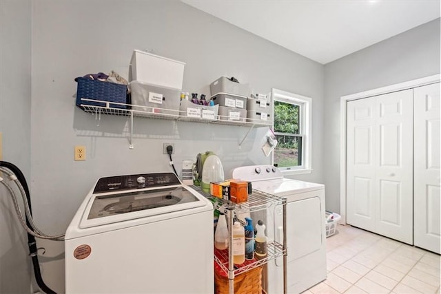 laundry room with light tile patterned floors and independent washer and dryer