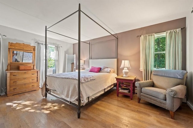 bedroom with hardwood / wood-style flooring