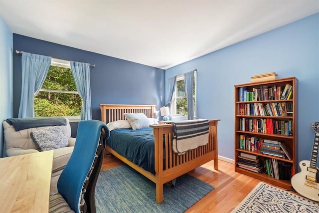 bedroom with hardwood / wood-style flooring