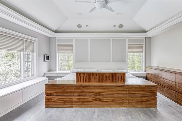 unfurnished bedroom featuring vaulted ceiling, multiple windows, and ceiling fan