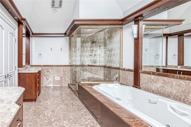 bathroom featuring tile patterned flooring, vanity, lofted ceiling, and shower with separate bathtub