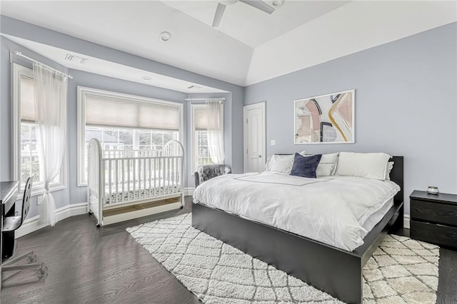 bedroom featuring hardwood / wood-style floors, ceiling fan, and vaulted ceiling