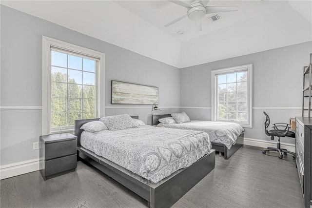 bedroom featuring ceiling fan and dark wood-type flooring