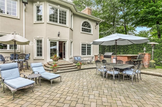 view of patio / terrace featuring area for grilling and exterior kitchen