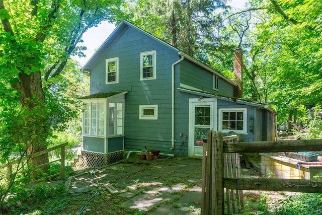 721 County Rte 7, Pine Plains, NY 12567 - back of house with a chimney and a garden