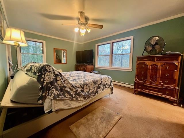 carpeted bedroom featuring ceiling fan, ornamental molding, and a baseboard heating unit