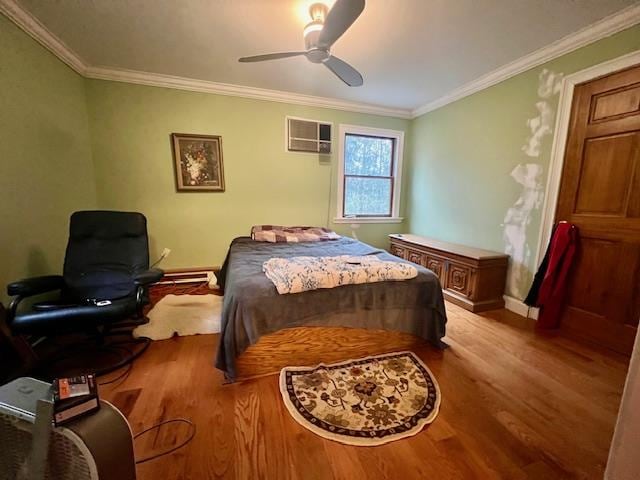 bedroom featuring light wood-type flooring, an AC wall unit, ceiling fan, and ornamental molding