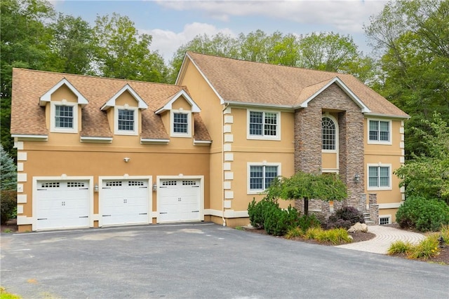 view of front of property with a garage