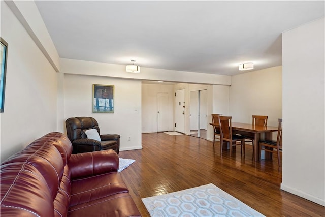 living room with dark hardwood / wood-style floors