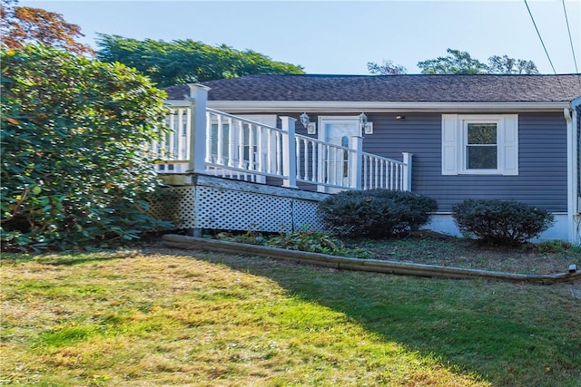 exterior space featuring a yard and a deck