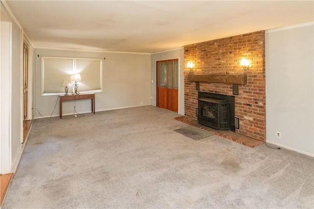 unfurnished living room with carpet flooring, a wood stove, and crown molding