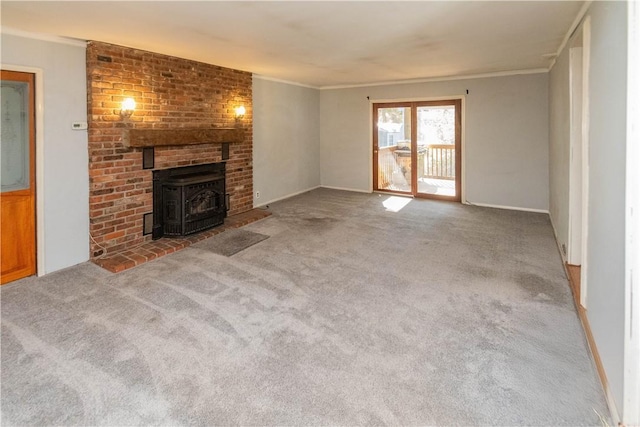 unfurnished living room featuring light colored carpet, a wood stove, and crown molding