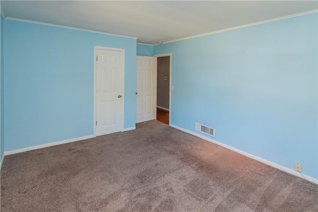 unfurnished bedroom with crown molding and carpet