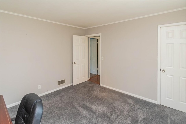 carpeted spare room featuring crown molding