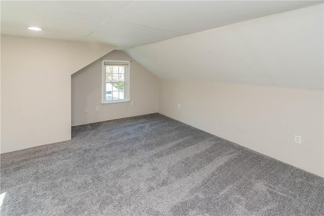 bonus room featuring carpet and lofted ceiling