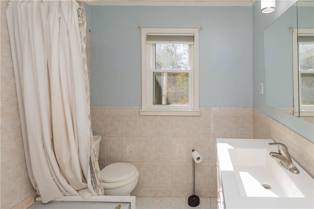 bathroom featuring toilet, sink, and tile walls