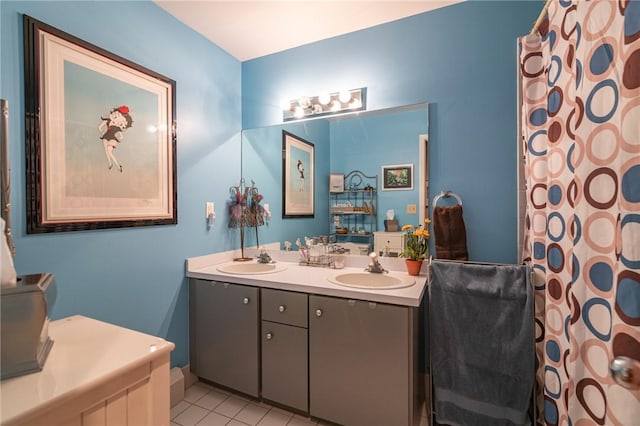 bathroom featuring tile patterned flooring and vanity